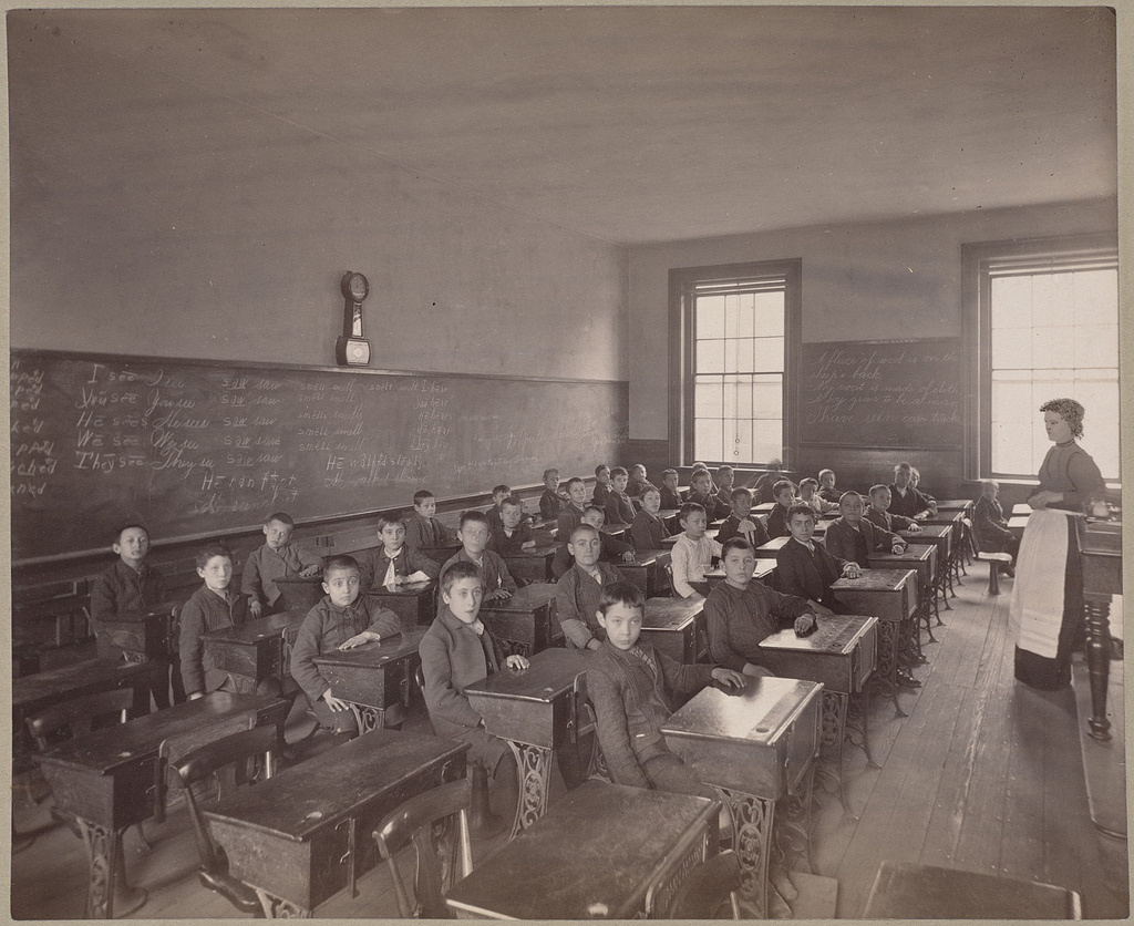 Immigrant children learning English in Boston schools, around 1890.